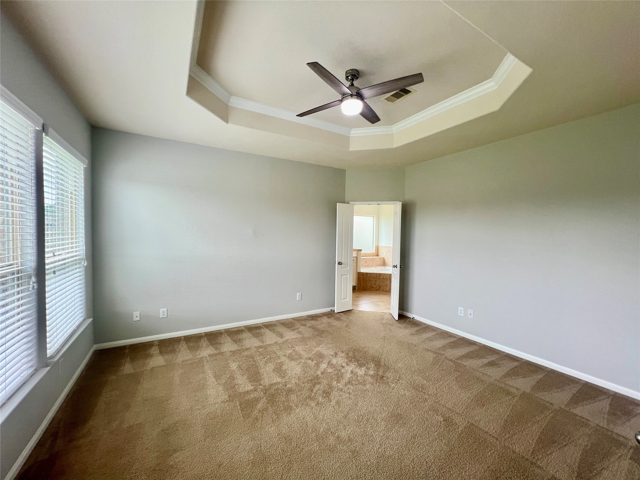 25307 Holton Ridge Drive Katy, TX 77494 - Photo 15 of 26 an empty room with ceiling fan and window