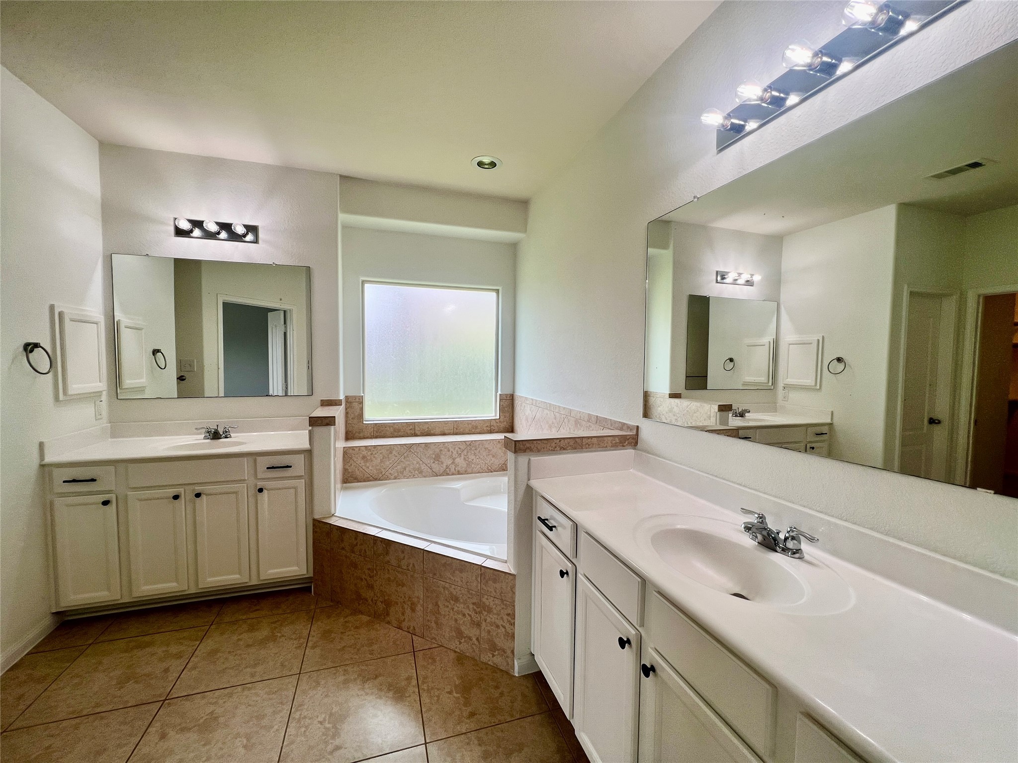 25307 Holton Ridge Drive Katy, TX 77494 - Photo 17 of 26 a bathroom with a sink vanity and mirror
