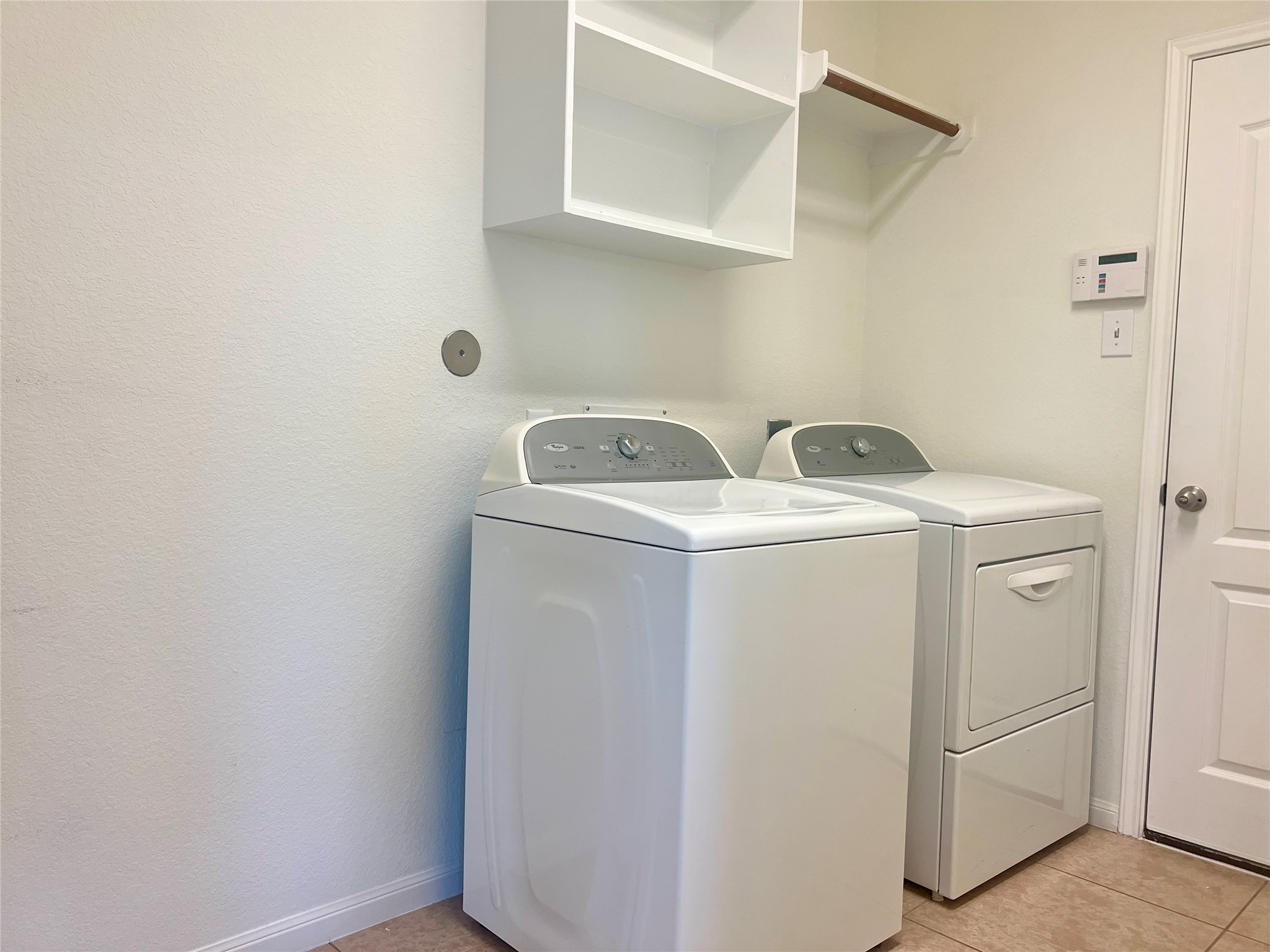 25307 Holton Ridge Drive Katy, TX 77494 - Photo 24 of 26 a utility room with dryer and washer