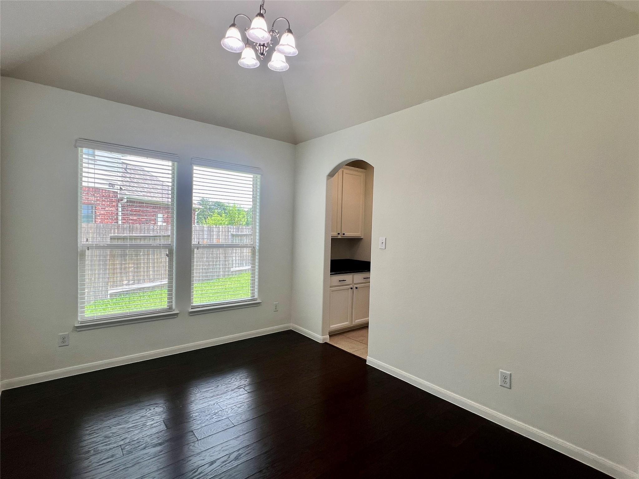 25307 Holton Ridge Drive Katy, TX 77494 - Photo 10 of 26 an empty room with wooden floor and windows