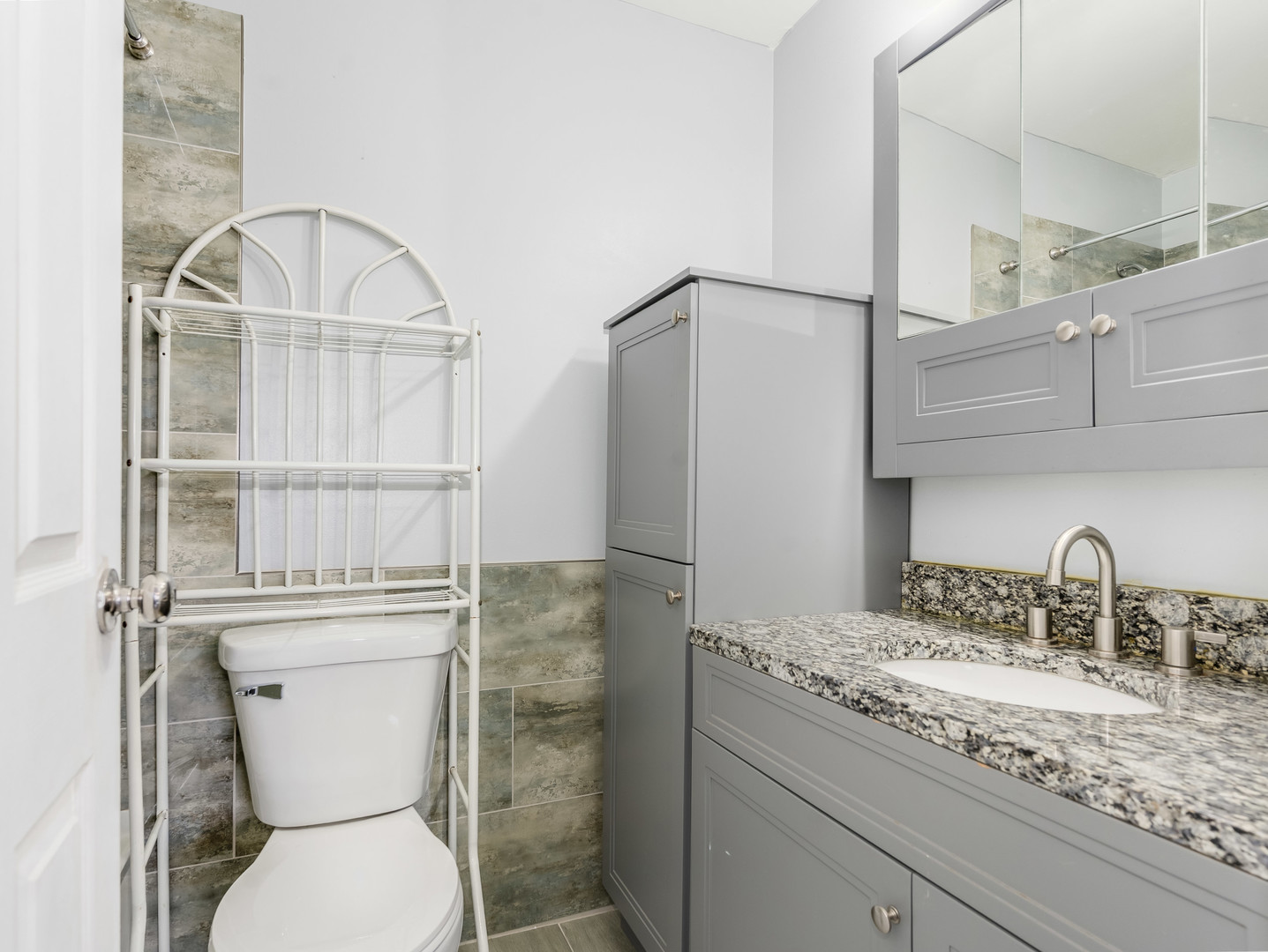 4721 St Joseph Creek Road, Unit 5F Lisle, IL 60532 - Photo 15 of 19 a bathroom with a toilet sink and shower