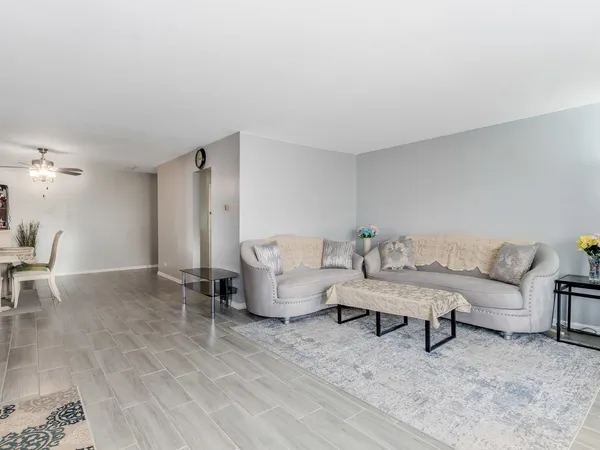 a living room with furniture and a table