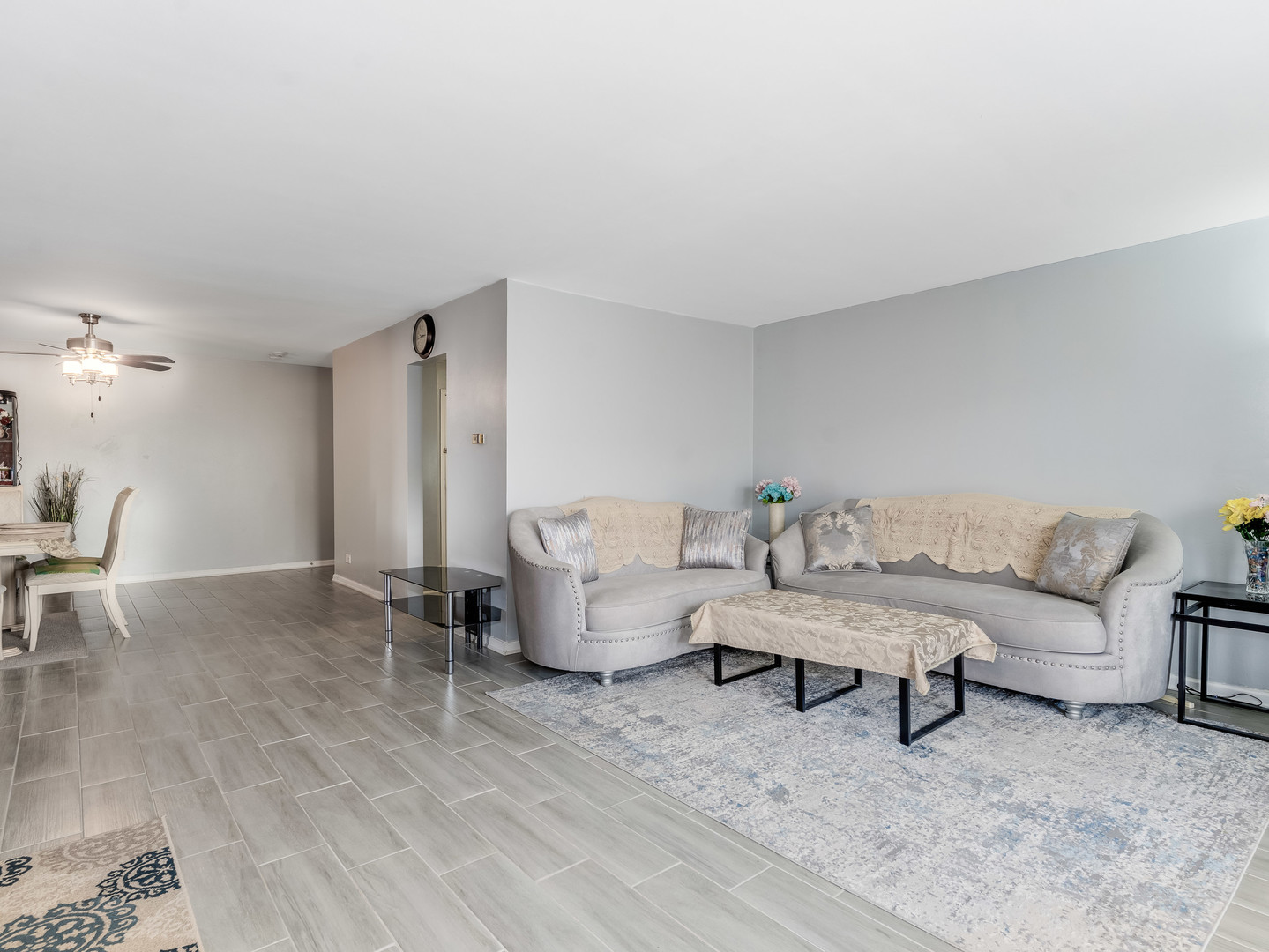 4721 St Joseph Creek Road, Unit 5F Lisle, IL 60532 - Photo 6 of 19 a living room with furniture and a table