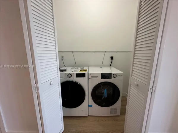 a utility room with dryer and washer