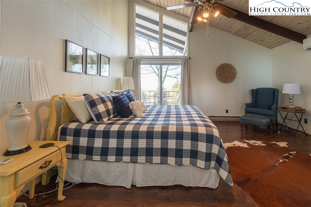 89 Rabbit Run Glade Valley, NC 28627 - Photo 17 of 32 a bedroom with a bed and a window