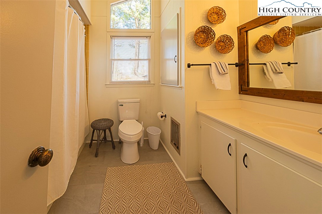 89 Rabbit Run Glade Valley, NC 28627 - Photo 18 of 32 a bathroom with a sink and a mirror
