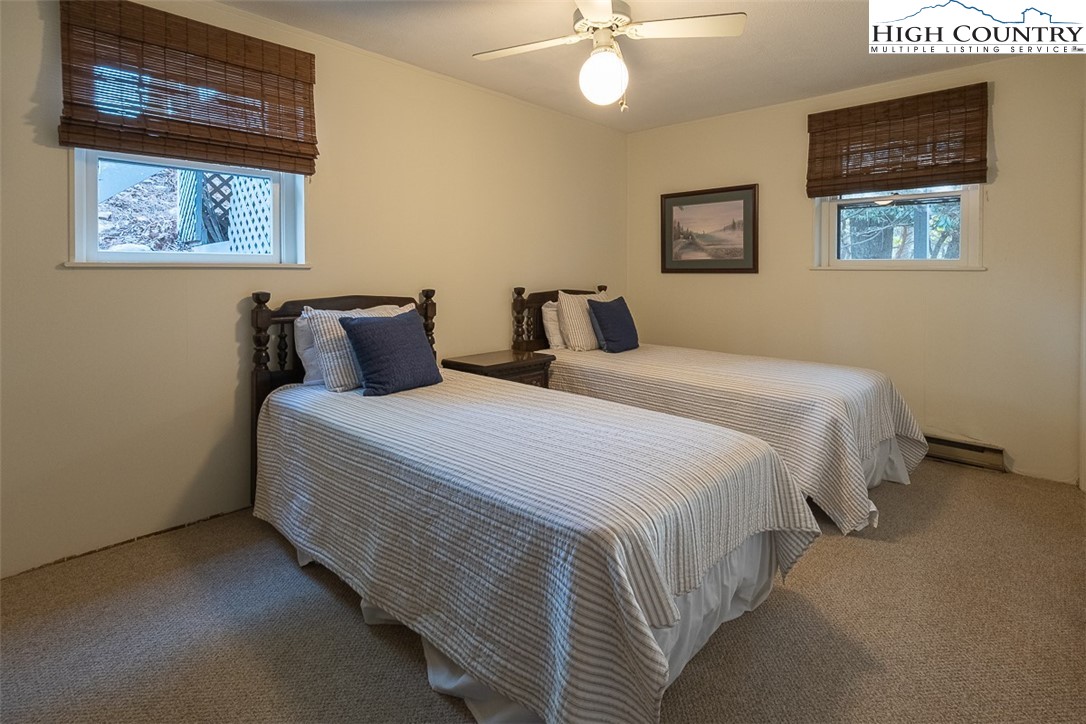 89 Rabbit Run Glade Valley, NC 28627 - Photo 23 of 32 a bedroom with bed and painting on the wall