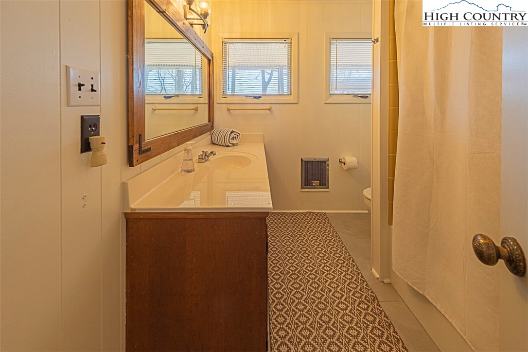 89 Rabbit Run Glade Valley, NC 28627 - Photo 25 of 32 a bathroom with a sink and a shower