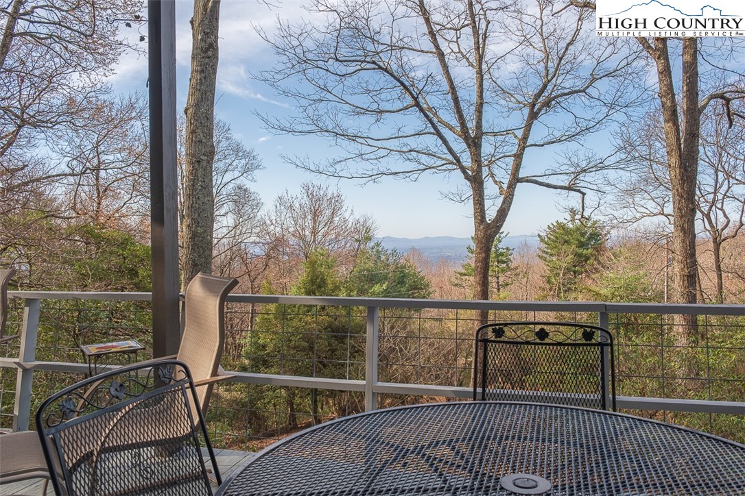 89 Rabbit Run Glade Valley, NC 28627 - Photo 27 of 32 a view of a balcony with wooden floor and fence