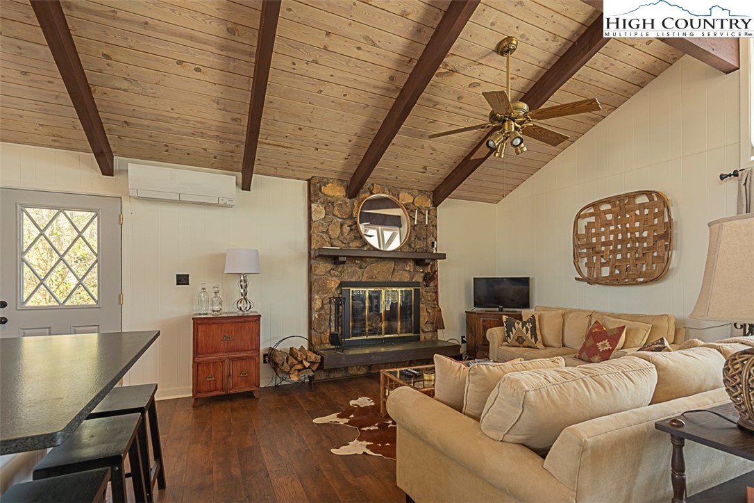 89 Rabbit Run Glade Valley, NC 28627 - Photo 7 of 32 a living room with furniture and a wooden floor