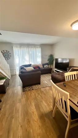 a living room with a couch and a flat screen tv