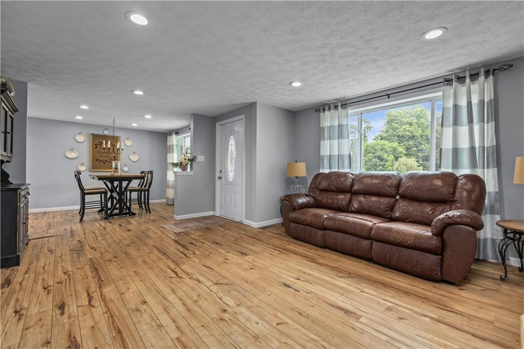 231 Hannahstown Road Cabot, PA 16023 - Photo 5 of 25 a living room with furniture and a large window