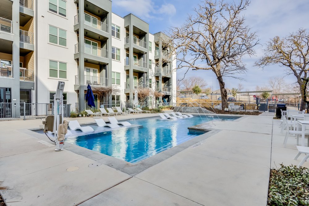 4801 Springdale Road, Unit 2107 Austin, TX 78723 - Photo 23 of 26 a view of a building with snow on the road