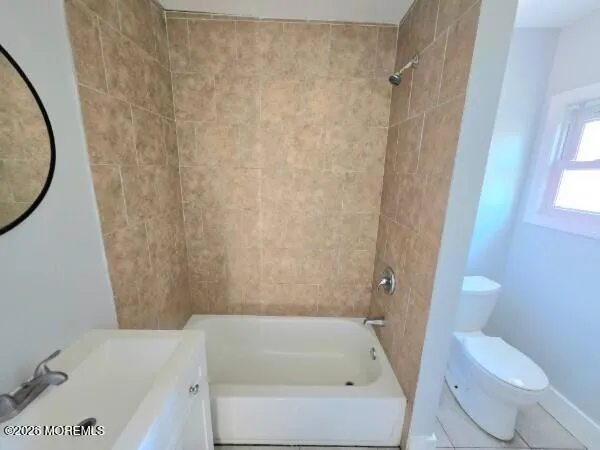 a bathroom with a bathtub and toilet