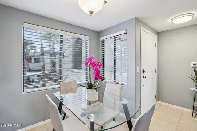 a view of a dining room with furniture wooden floor and a chandelier