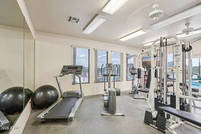 a view of a swimming pool with a table and chairs