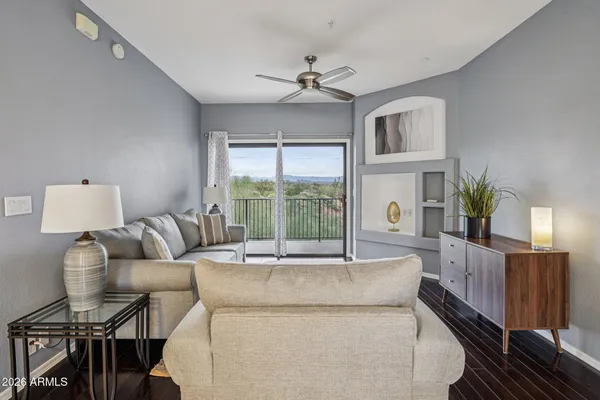 a living room with furniture and a large window