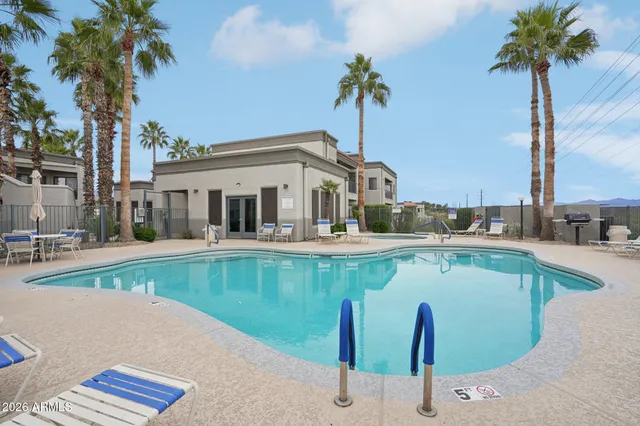 a view of a lake with houses in the back