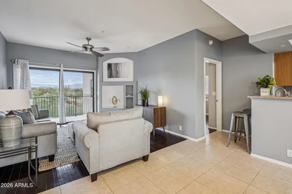a living room with furniture and a large window