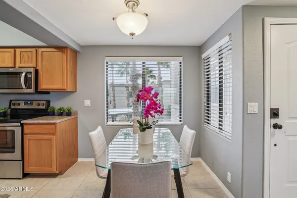 a dining room with furniture and window