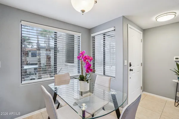 a kitchen with stainless steel appliances granite countertop a refrigerator a stove a sink and a microwave