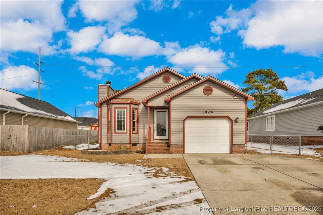 a view of a white house with a large space