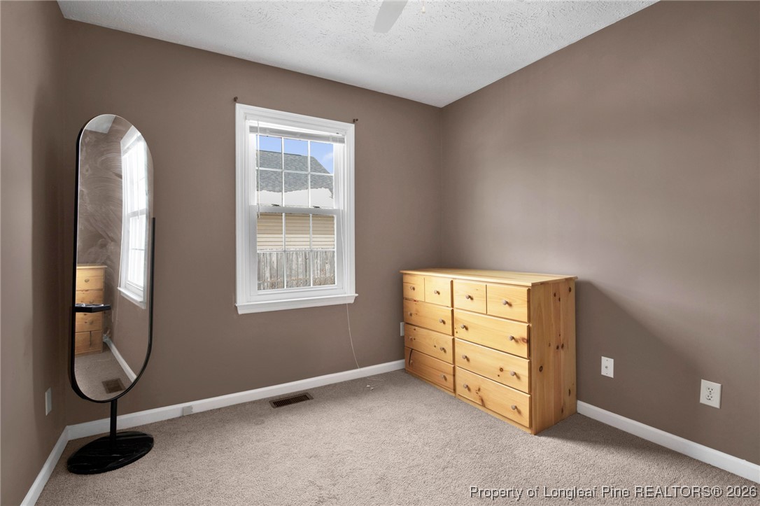 3824 Constance Road Hope Mills, NC 28348 - Photo 16 of 32 a view of a room with bed and windows