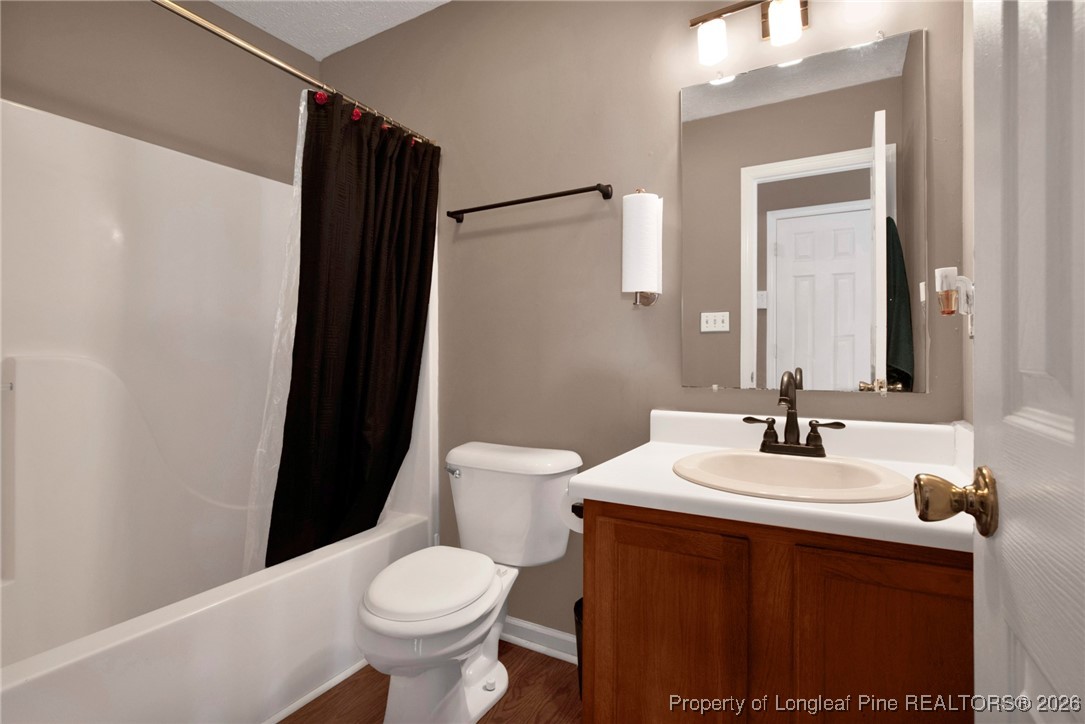 3824 Constance Road Hope Mills, NC 28348 - Photo 20 of 32 a bathroom with a sink and a mirror