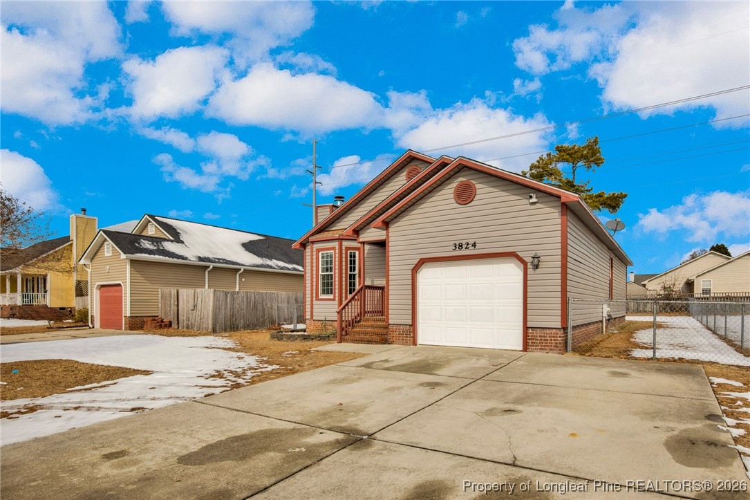 3824 Constance Road Hope Mills, NC 28348 - Photo 2 of 32 a front view of a house with a yard