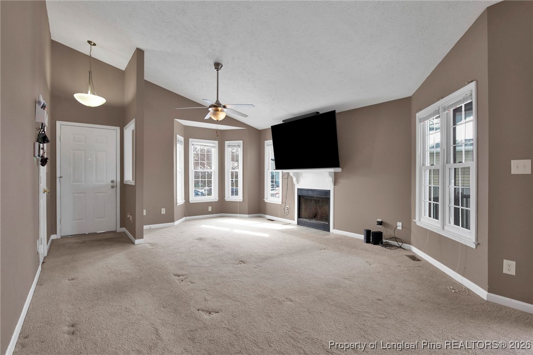 3824 Constance Road Hope Mills, NC 28348 - Photo 7 of 32 a view of a livingroom with an empty space and a fireplace
