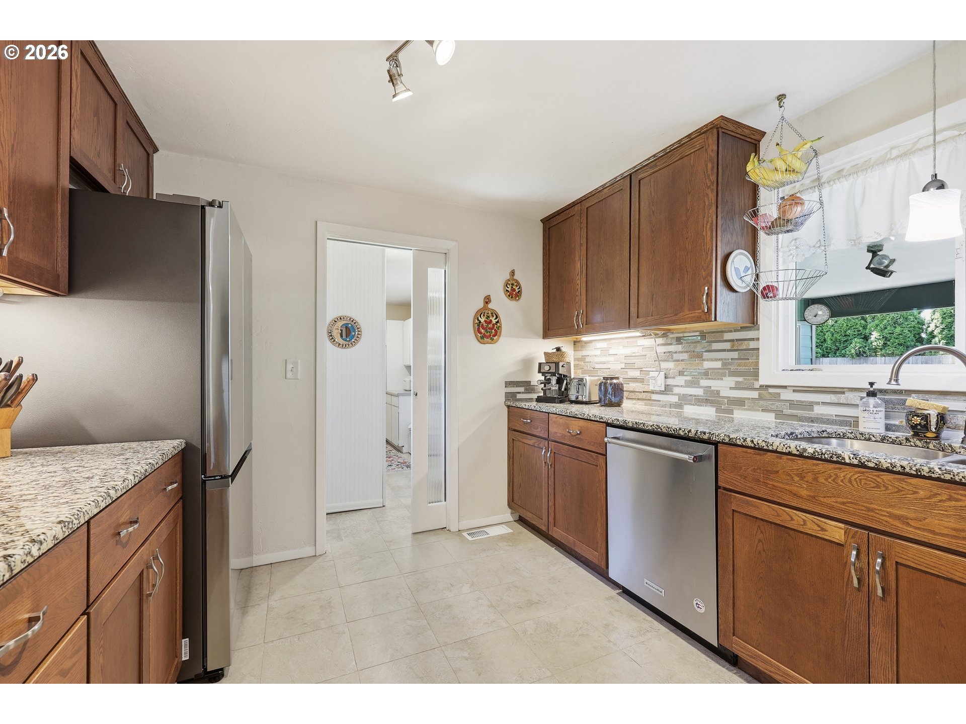 65 Greenvale Drive Springfield, OR 97477 - Photo 17 of 42 a kitchen with a sink stove and refrigerator