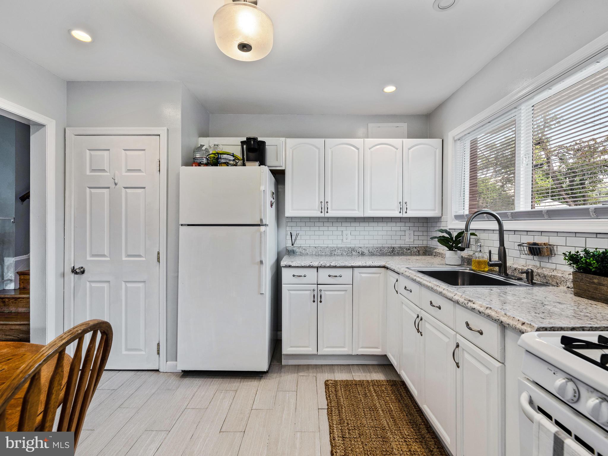 1023 Marksworth Road Baltimore, MD 21228 - Photo 12 of 33 Subway tile backsplash and recessed lighting.