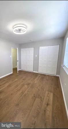 an empty room with a empty space and windows