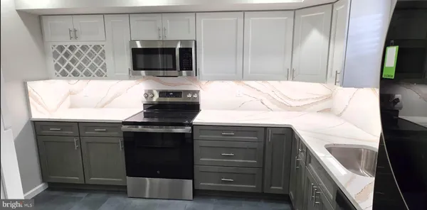 a kitchen with a sink and a microwave