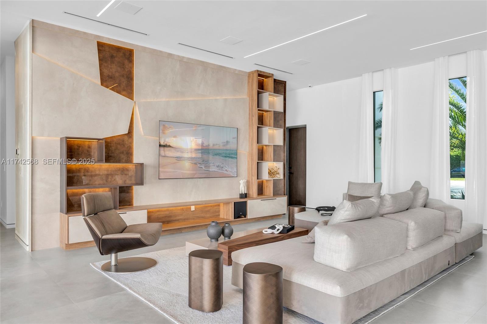 9890 Southwest 64th Street Miami, FL 33173 - Photo 16 of 61 a living room with furniture and a large window