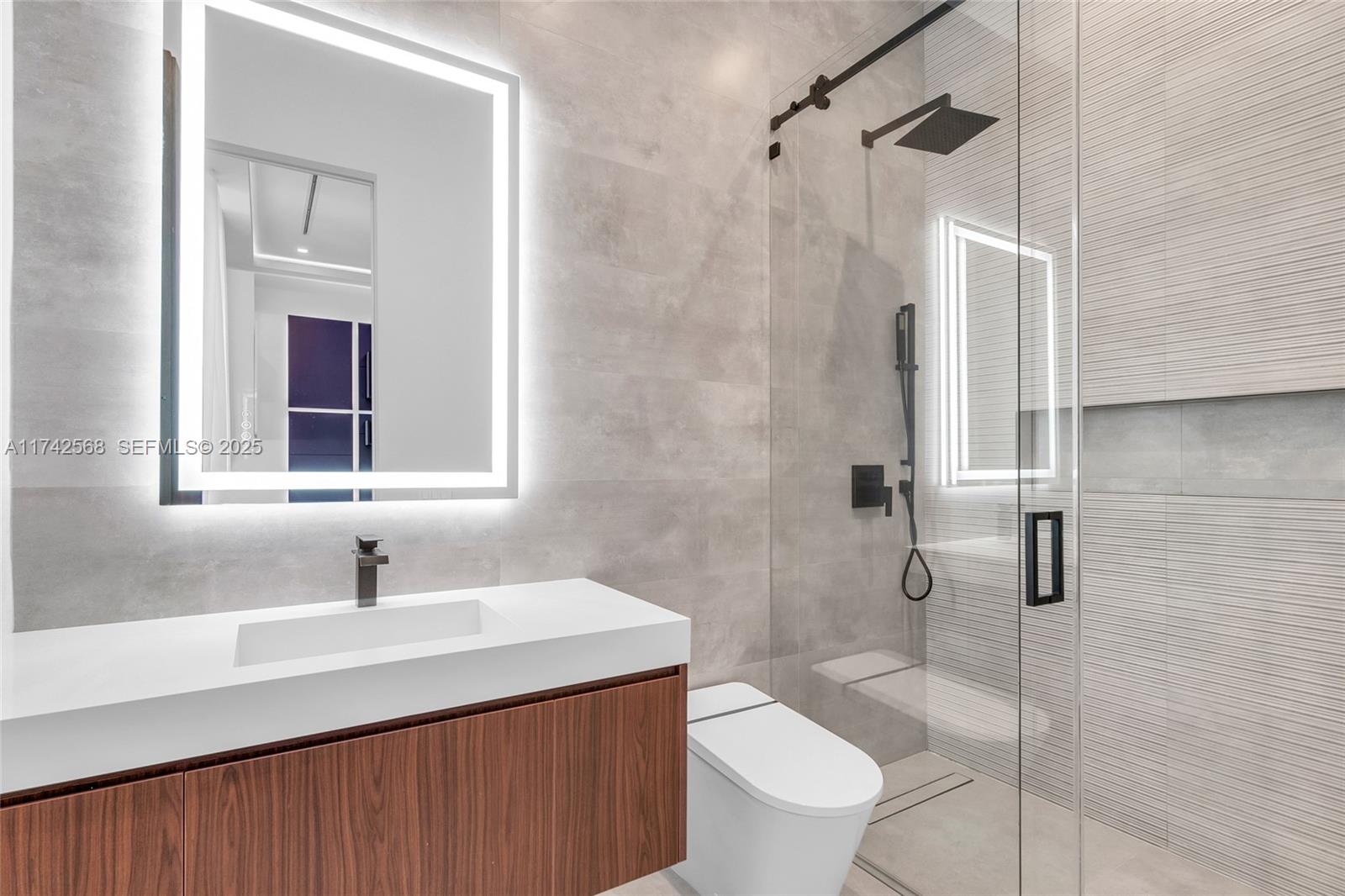 9890 Southwest 64th Street Miami, FL 33173 - Photo 23 of 61 a bathroom with a sink toilet and shower