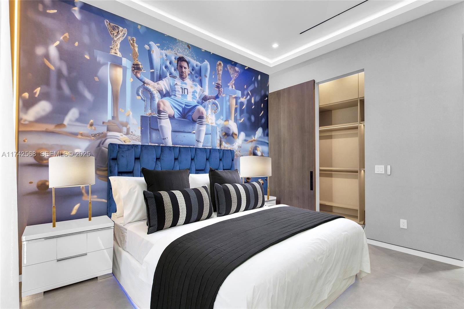 9890 Southwest 64th Street Miami, FL 33173 - Photo 25 of 61 a bedroom with a large bed and a couch