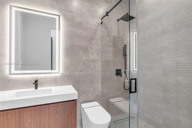 a kitchen with a sink and a stove top oven