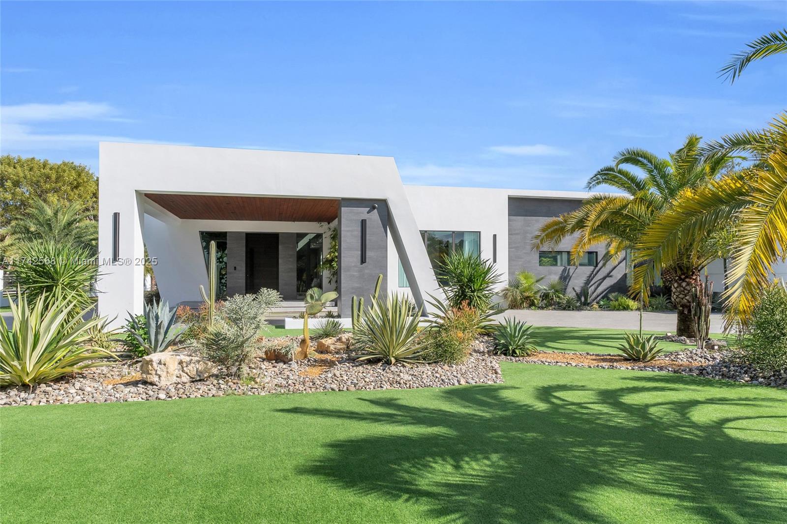 9890 Southwest 64th Street Miami, FL 33173 - Photo 3 of 61 a view of a house with a yard and plants