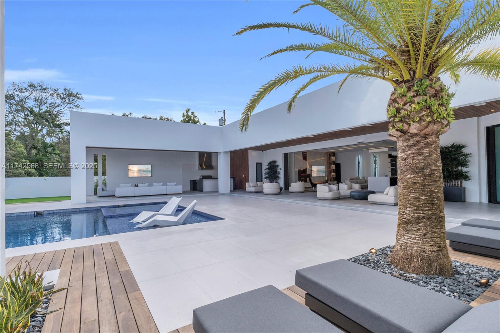 9890 Southwest 64th Street Miami, FL 33173 - Photo 48 of 61 a view of a house with backyard porch and sitting area