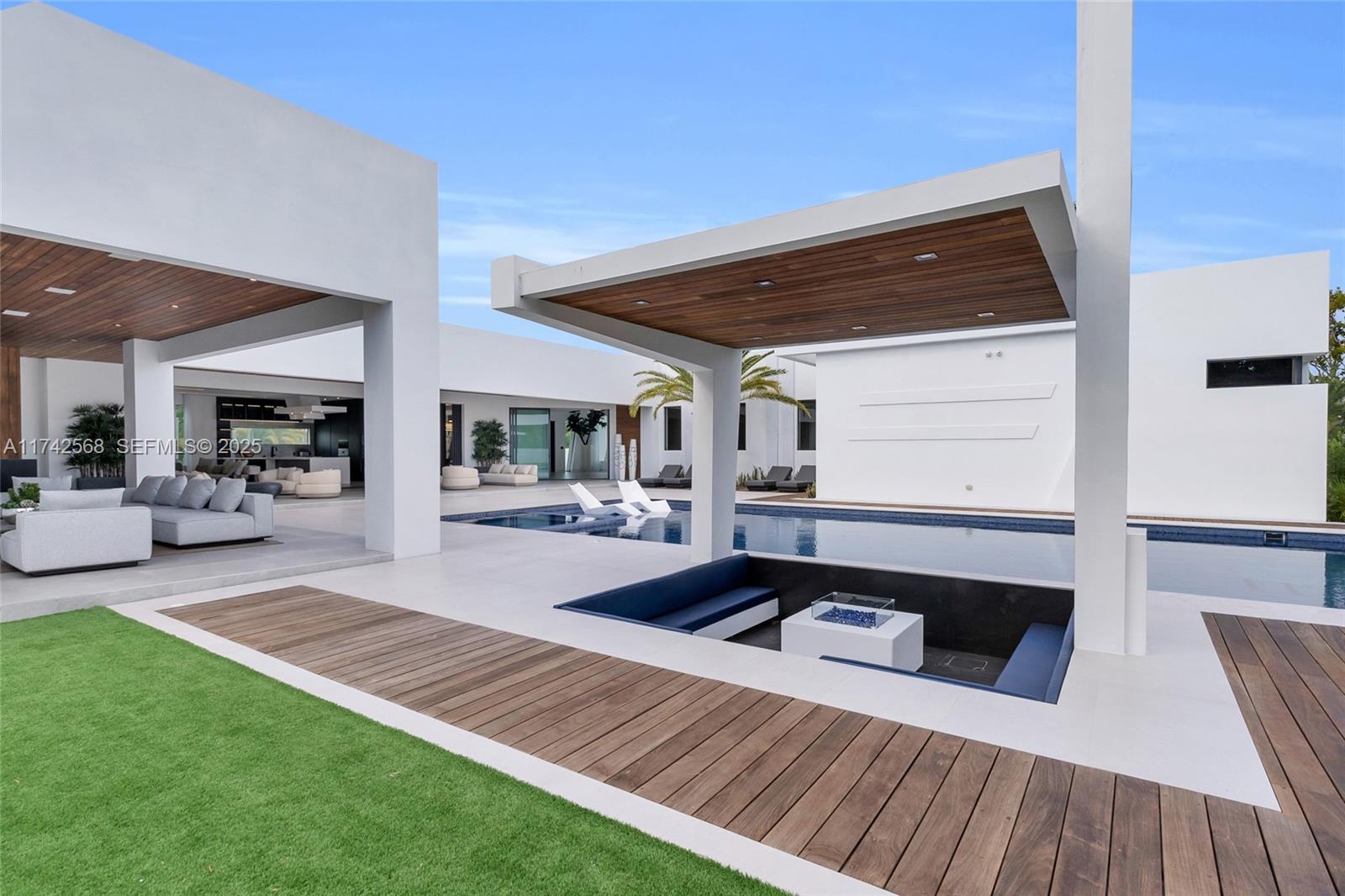 9890 Southwest 64th Street Miami, FL 33173 - Photo 49 of 61 a swimming pool view with a outdoor seating space