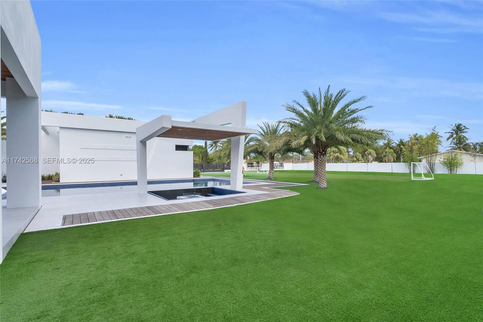 9890 Southwest 64th Street Miami, FL 33173 - Photo 51 of 61 a view of a house with a backyard porch and sitting area