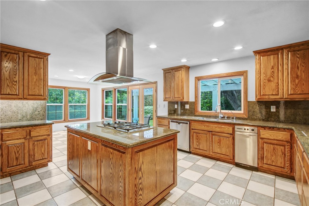 1249 Oakhaven Road Arcadia, CA 91006 - Photo 16 of 55 a kitchen with stainless steel appliances granite countertop a stove sink and cabinets