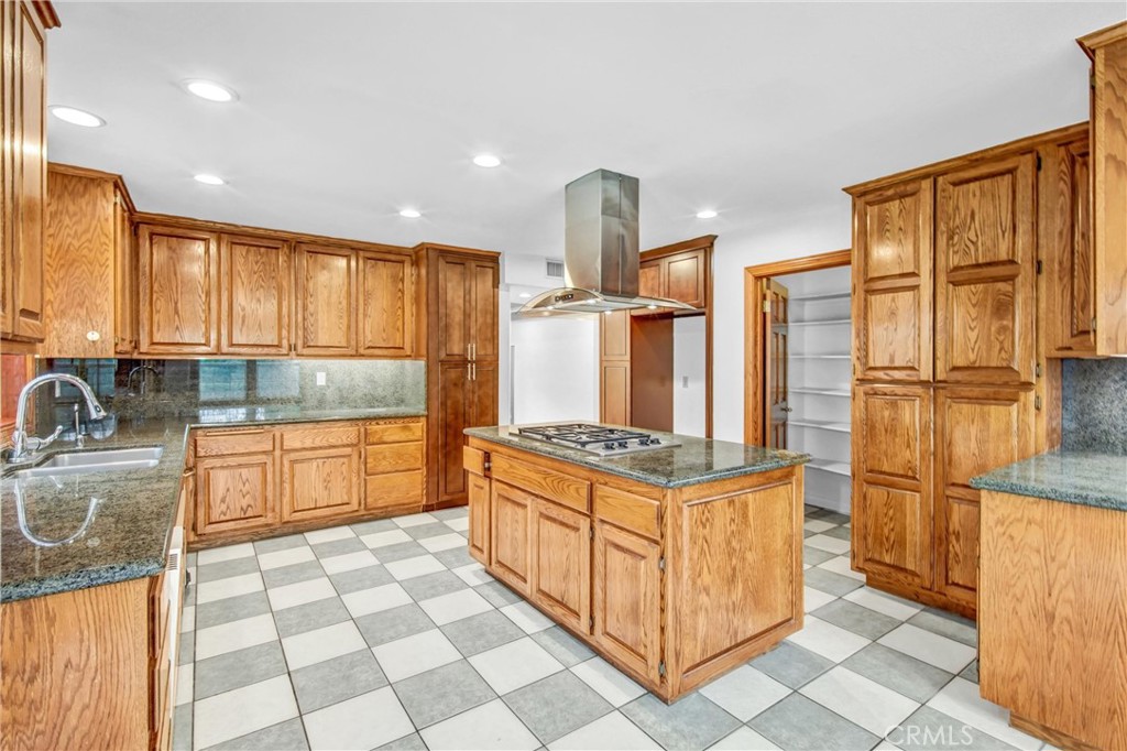 1249 Oakhaven Road Arcadia, CA 91006 - Photo 17 of 55 a kitchen with stainless steel appliances granite countertop a stove a sink and a refrigerator