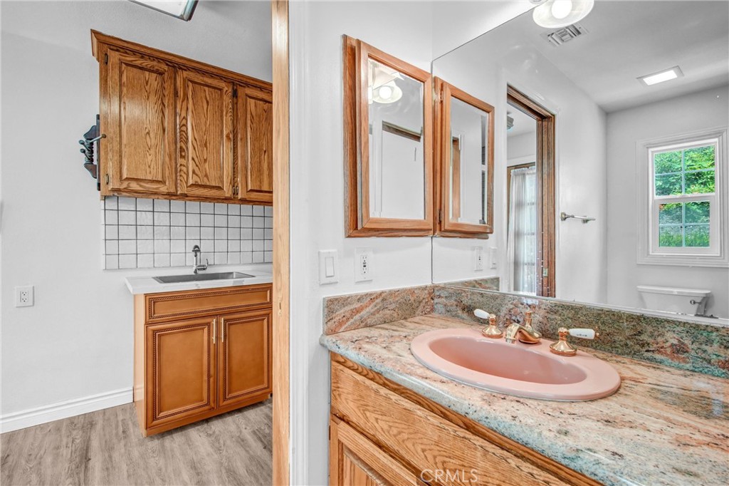 1249 Oakhaven Road Arcadia, CA 91006 - Photo 19 of 55 a bathroom with a sink and a mirror