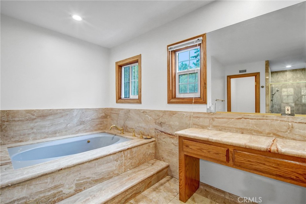 1249 Oakhaven Road Arcadia, CA 91006 - Photo 26 of 55 a bathroom with a granite countertop sink and bathtub