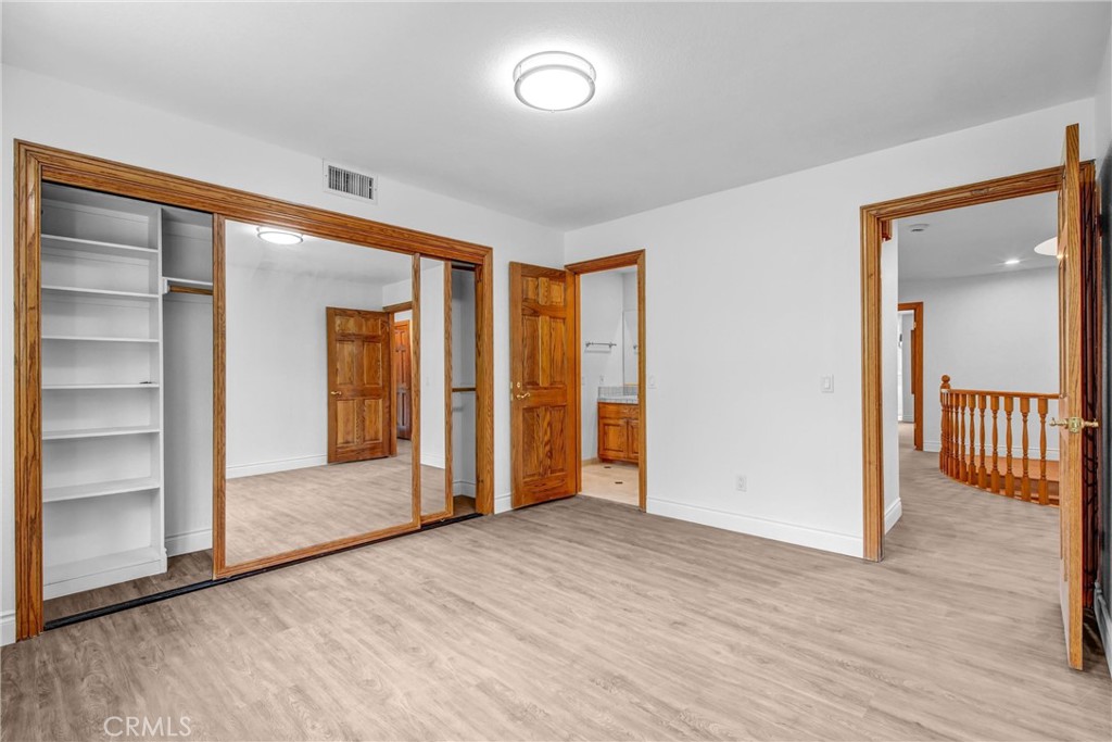 1249 Oakhaven Road Arcadia, CA 91006 - Photo 31 of 55 a view of empty room with wooden floor and fan