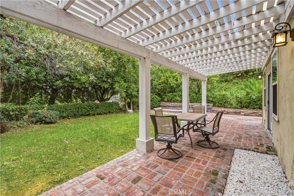 1249 Oakhaven Road Arcadia, CA 91006 - Photo 42 of 55 a view of a patio with a table chairs and a backyard