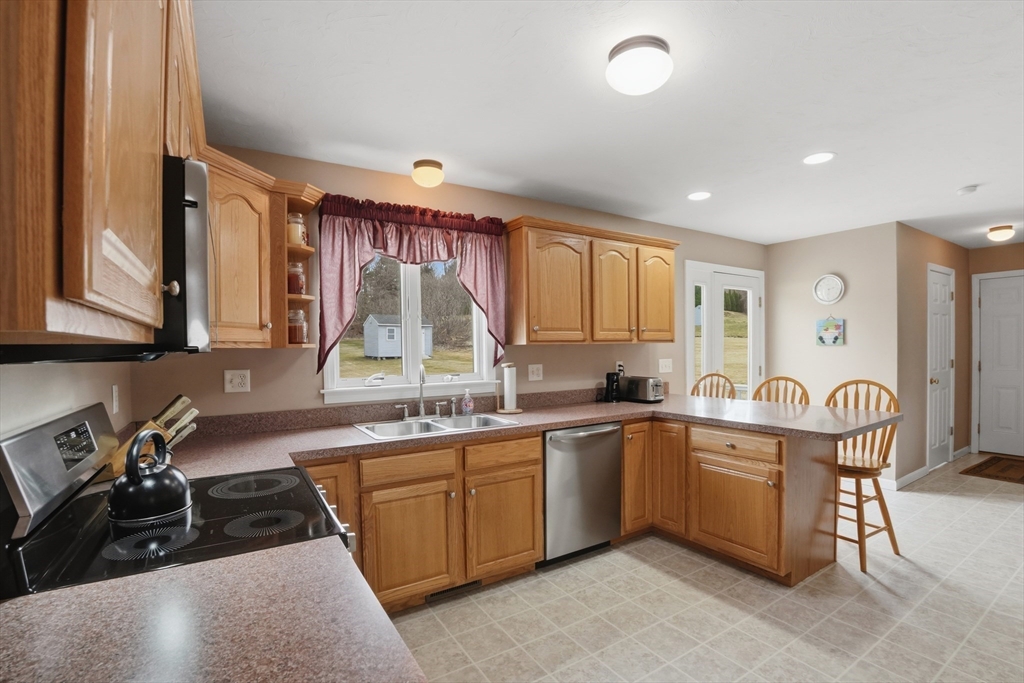 23 Bridle Path Auburn, MA 01501 - Photo 13 of 40 a kitchen with lots of counter top space