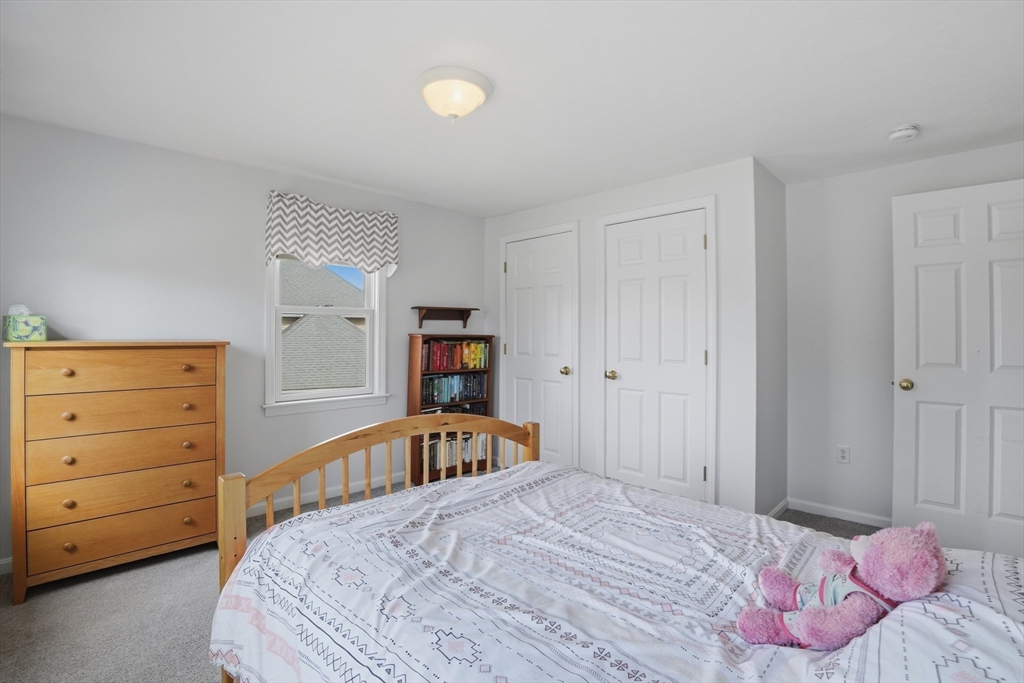 23 Bridle Path Auburn, MA 01501 - Photo 26 of 40 a bedroom with a bed and a closet